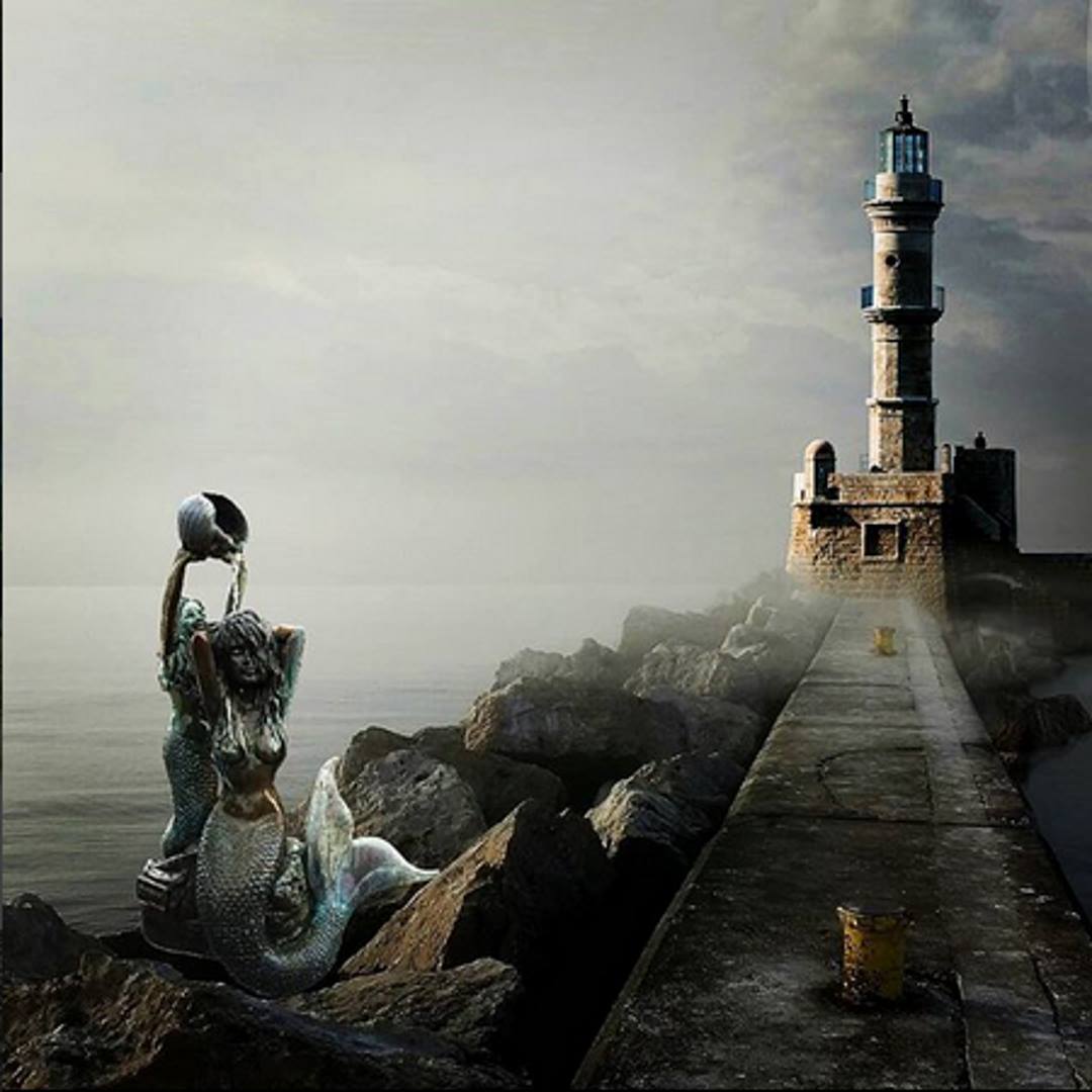 Mermaid sirens on the rocks